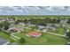 A high aerial view of the property shows the roof, yard, and surrounding neighborhood at 23141 Corvin Ave, Port Charlotte, FL 33954