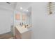 Bathroom with large mirror, lots of natural light and calming color palette at 23141 Corvin Ave, Port Charlotte, FL 33954