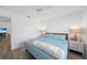 This bedroom features a comfortable queen bed, calming color palette, and bright interior at 23141 Corvin Ave, Port Charlotte, FL 33954