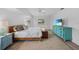 Bedroom featuring a wooden bed frame, ample natural light, a TV, and wood-look floors at 23141 Corvin Ave, Port Charlotte, FL 33954