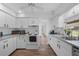 Bright kitchen featuring recessed lighting, stainless steel appliances, and wood-look flooring at 23141 Corvin Ave, Port Charlotte, FL 33954