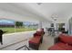 A screened lanai with comfortable seating, offering a relaxing outdoor living space at 23141 Corvin Ave, Port Charlotte, FL 33954