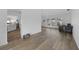 Bright living room with wood-look floors, neutral walls, and an open layout at 23141 Corvin Ave, Port Charlotte, FL 33954