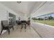 Enjoy the spacious covered patio, perfect for outdoor entertaining with a beautiful backyard view at 23141 Corvin Ave, Port Charlotte, FL 33954