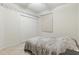Cozy bedroom with closet, tile floors, and neutral paint at 2329 Como St, Port Charlotte, FL 33948