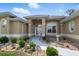 Charming single-story home featuring a landscaped walkway, arched entry, and manicured front yard at 2329 Como St, Port Charlotte, FL 33948