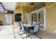 Comfortable outdoor dining setup under a covered and screened lanai, perfect for gatherings at 2329 Como St, Port Charlotte, FL 33948