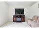 Inviting living room features a fireplace and built-in entertainment center with tile floors at 2329 Como St, Port Charlotte, FL 33948