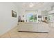 Open-concept living area featuring tile floors, and large windows showcasing the outdoor views at 2329 Como St, Port Charlotte, FL 33948