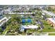 Aerial view of the complex featuring tennis courts and well maintained landscaping at 2437 Harbor Blvd # 114, Port Charlotte, FL 33952