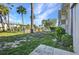 Expansive backyard featuring green space, mature trees, and serene surroundings at 2437 Harbor Blvd # 114, Port Charlotte, FL 33952