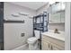 Compact bathroom with a toilet, vanity with sink, and shelving for storage at 2437 Harbor Blvd # 114, Port Charlotte, FL 33952