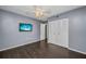 Comfortable bedroom featuring a ceiling fan, a closet, and dark wood flooring at 2437 Harbor Blvd # 114, Port Charlotte, FL 33952