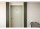 Condo unit door with a chair on the patio at 2437 Harbor Blvd # 114, Port Charlotte, FL 33952