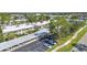 Exterior of a low-rise condo building with covered parking and some guest parking spaces at 2437 Harbor Blvd # 114, Port Charlotte, FL 33952