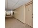 Hallway leading to the unit featuring wall to wall carpet at 2437 Harbor Blvd # 114, Port Charlotte, FL 33952