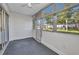 This lanai features tiled flooring and several windows providing natural light and views of the property at 2437 Harbor Blvd # 114, Port Charlotte, FL 33952
