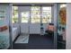 Bright lanai features a sitting area, storage, and a view of the well maintained yard at 2437 Harbor Blvd # 114, Port Charlotte, FL 33952