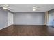 Spacious living room with wood floors and sliding glass doors to lanai at 2437 Harbor Blvd # 114, Port Charlotte, FL 33952