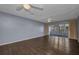 Open living room with wood floors and access to screened lanai at 2437 Harbor Blvd # 114, Port Charlotte, FL 33952