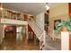 Well-lit lobby with stairs, plants and decor at 2437 Harbor Blvd # 114, Port Charlotte, FL 33952