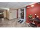 Building entrance with ramp, tile floor, and decorated console table at 2437 Harbor Blvd # 114, Port Charlotte, FL 33952