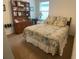 Bedroom featuring a large bed, dresser, and bookshelf with a neutral color palette and carpet at 25228 E Lenox Cir, Punta Gorda, FL 33950