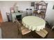 Small dining room with carpet, table with four chairs, vintage desk and bookshelf at 25228 E Lenox Cir, Punta Gorda, FL 33950