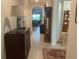 Welcoming foyer featuring tile flooring, decorative furniture, and an arched doorway leading to the living area at 25228 E Lenox Cir, Punta Gorda, FL 33950
