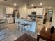 Spacious kitchen boasts a center island, stainless steel appliances, and white cabinets for a clean, modern look at 25228 E Lenox Cir, Punta Gorda, FL 33950