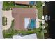 Overhead aerial of home and yard with screened-in pool, boat dock and lift at 2814 La Mancha Ct, Punta Gorda, FL 33950