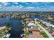 Waterfront living at its finest with a private dock, boat lift, and pool amidst a scenic coastal neighborhood at 2814 La Mancha Ct, Punta Gorda, FL 33950