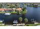 Waterfront home with boat lift, dock, sailboat and lush landscaping at 2814 La Mancha Ct, Punta Gorda, FL 33950