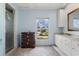 Well-lit bathroom featuring a vanity, shower, window, and ample storage at 2814 La Mancha Ct, Punta Gorda, FL 33950