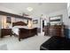 Primary bedroom features a ceiling fan, tile flooring, dark furniture and ample closet space at 2814 La Mancha Ct, Punta Gorda, FL 33950