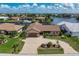Well-manicured home with paver driveway and lush landscaping at 2814 La Mancha Ct, Punta Gorda, FL 33950