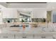 Kitchen features white cabinets, stainless appliances, and large marble countertop at 2814 La Mancha Ct, Punta Gorda, FL 33950