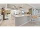 Updated kitchen featuring white cabinets, marble countertops, and a stone fireplace at 2814 La Mancha Ct, Punta Gorda, FL 33950