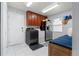 Laundry room with modern appliances and cabinetry at 2814 La Mancha Ct, Punta Gorda, FL 33950