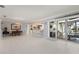 Open living room with sliding glass doors leading to the patio and pool at 2814 La Mancha Ct, Punta Gorda, FL 33950