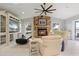 Living room with stone fireplace, white furniture, and scenic views at 2814 La Mancha Ct, Punta Gorda, FL 33950