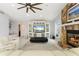 Cozy living room featuring a stone fireplace, entertainment center, and comfortable seating at 2814 La Mancha Ct, Punta Gorda, FL 33950