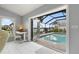 Office/flex space overlooks the pool and a tranquil waterfront with lots of natural light at 2814 La Mancha Ct, Punta Gorda, FL 33950