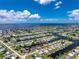 Wide aerial view of waterfront community with numerous canals and beautiful blue water at 330 Weber Ter, Port Charlotte, FL 33952