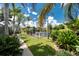 Lush backyard features tropical plants, a canal view and tranquil setting at 330 Weber Ter, Port Charlotte, FL 33952