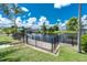 Waterfront backyard featuring canal access, lush lawn and tropical landscaping at 330 Weber Ter, Port Charlotte, FL 33952