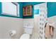 Bathroom featuring a toilet, cabinet, window, and walk in shower behind a curtain at 330 Weber Ter, Port Charlotte, FL 33952
