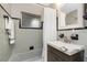 Bathroom featuring a vanity, mirror, shower with curtain and grey tiling at 330 Weber Ter, Port Charlotte, FL 33952