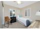 Cozy bedroom with a twin bed, desk, chair and natural light from two windows at 330 Weber Ter, Port Charlotte, FL 33952