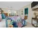 Charming bedroom with colorful bedding, plantation shutters, and ensuite bathroom at 330 Weber Ter, Port Charlotte, FL 33952